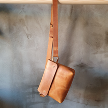 Load image into Gallery viewer, vegetable tanned leather, vegetable tanned leather handbag, cognac leather, leather cross bag, leather hip bag, cognac leather bag, leather craft, leather handmade bag,
